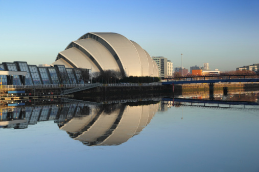 Glasgow's Armadillo in winter sunshine reflected off River Clyde