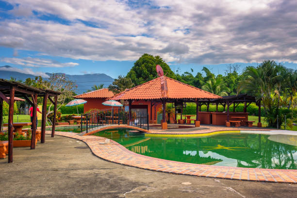 Hotel Rancho Leon located near Manuel Antonio National Park in Costa Rica Quepos, Costa Rica - January 14, 2020 : Hotel Rancho Leon with an outdoor swimming pool located near Manuel Antonio National Park in Costa Rica. manuel antonio national park stock pictures, royalty-free photos & images