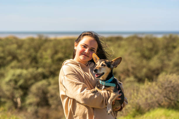 istock Thirteen year old with pet terrier outdoor portrait 1315353903