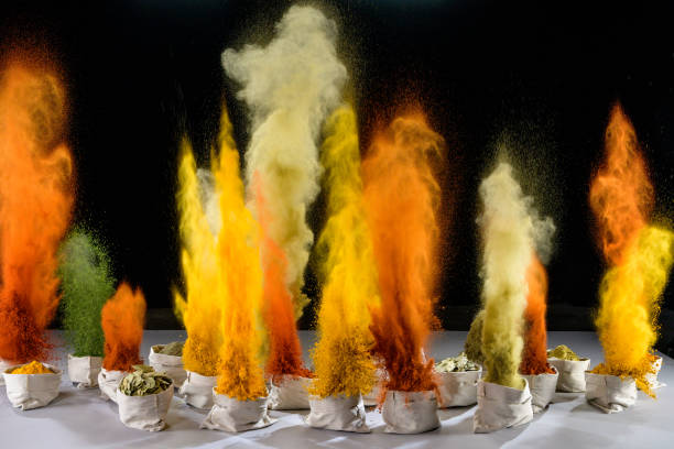 Bags of colourful spices exploding into air