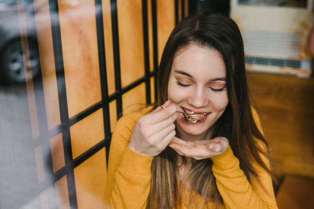 istock Woman eating cake 1315357005