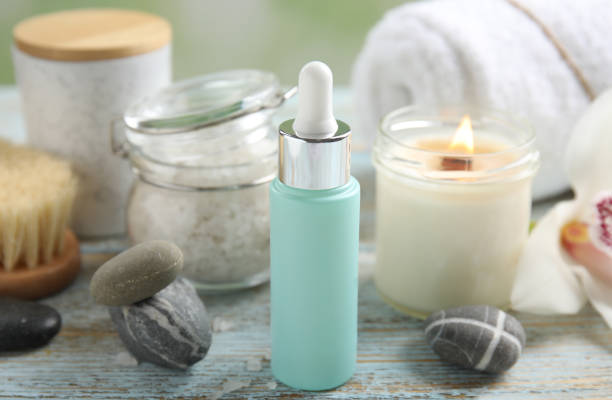 istock Composition with spa cosmetic and orchid flower on light wooden table, closeup 1315357701