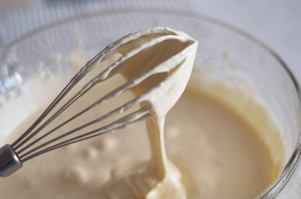 istock Whisk with whipped cream close-up 1315358341