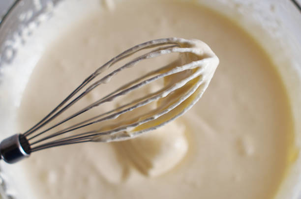 istock Whisk with whipped cream close-up 1315358396