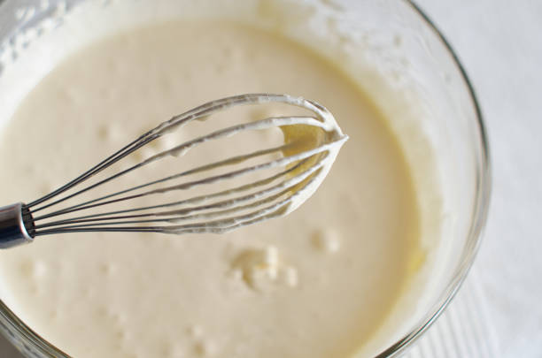 istock Whisk with whipped cream close-up 1315358477