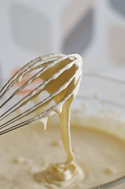 istock Whisk with whipped cream close-up 1315358482