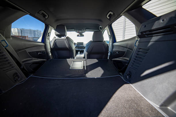 istock empty trunk of a modern car with folded rear seats. large interior volume. trunk view 1315358581