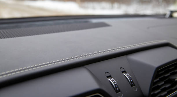 white trim on the black leather interior of a premium modern car. close-up. selective focus stock photo