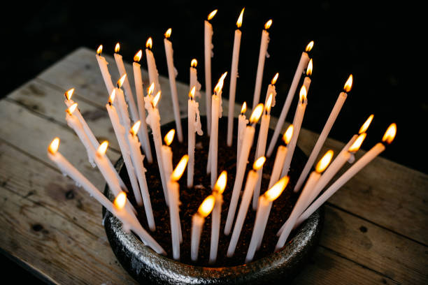istock Thin candles stuck in a bowl with soil 1315358796