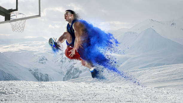 Young professional basketball player in action isolated over light background.