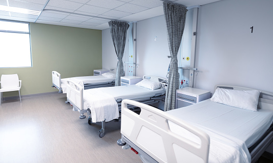 General view of an empty hospital room with three beds. medicine, health and healthcare services.