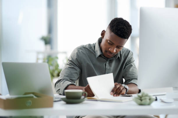 istock Shot of a young businessman working on a computer in an office 1315363684