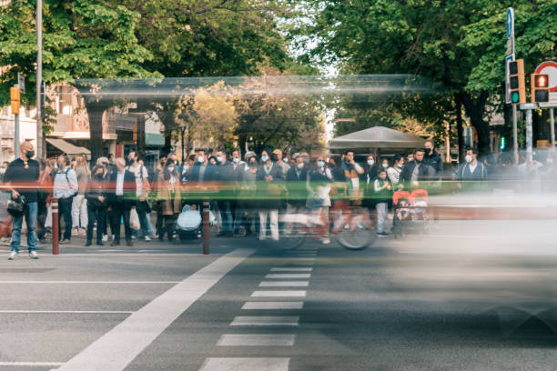 istock People wearing masks walking on zebra crossing 1315363951