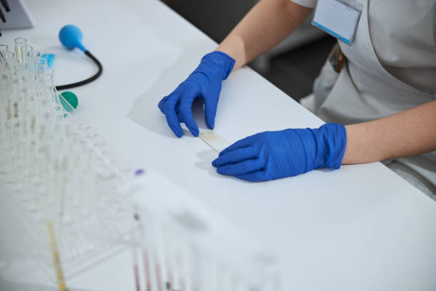 istock Experienced clinical biochemist preparing a specimen for microscopic examination 1315366468