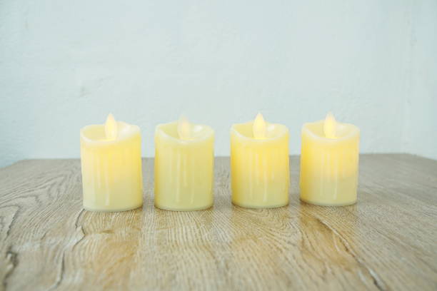 istock LED Candle Light electronic with space copy on wooden background 1315367730