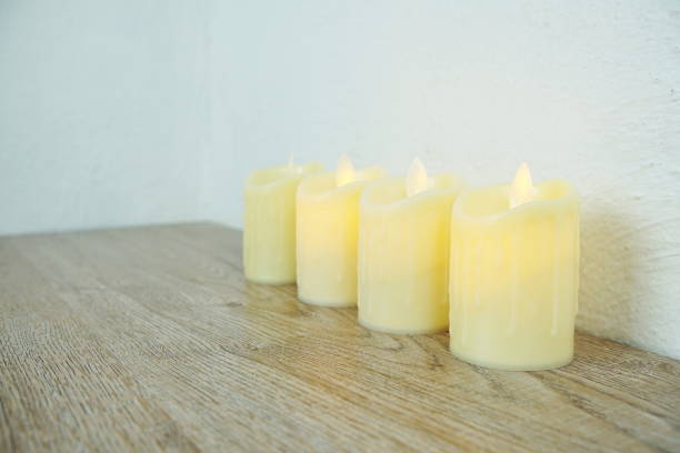 istock LED Candle Light electronic with space copy on wooden background 1315368089