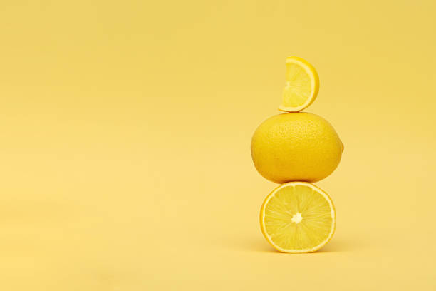 istock Yellow lemons set on yellow background. Yellow lemon pyramid. 1315372661