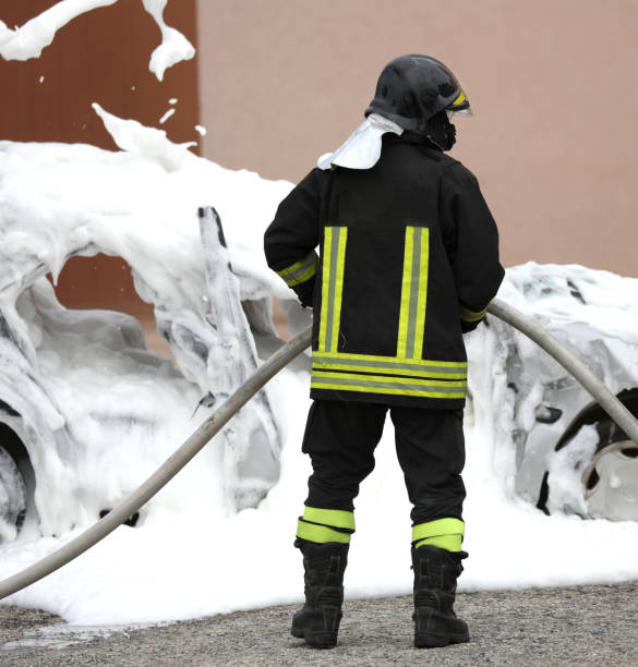 istock firefighter extinguishing a fire a car with the foam 1315372948