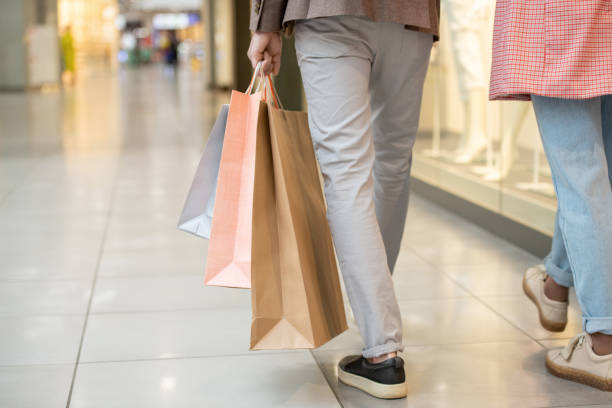 istock A person carrying a shopping bag while moving inside mall 1315373224