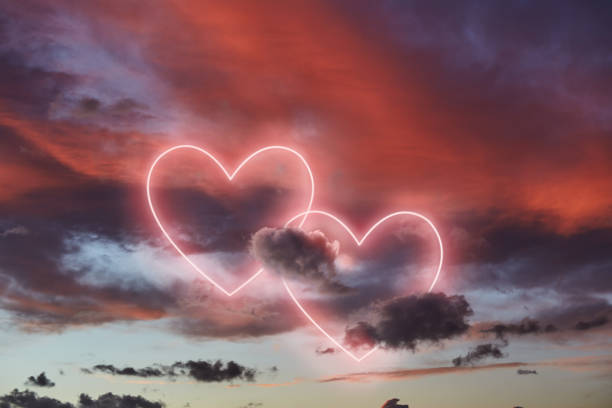 istock red clouds and neon heart shape in the sky 1315374341