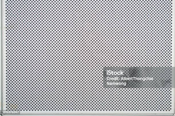A Hole On A White Metal Background Stock Photo - Download Image Now - Perforated, Metal, Textured