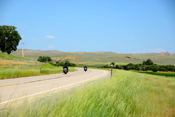 motorcycle riding in prairie - prairie wide landscape sky imagens e fotografias de stock