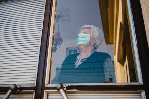 istock Senior woman with protective face mask 1315378650
