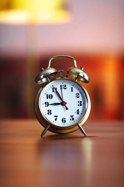 istock old gold alarm clock - 9 O'Clock 1315382451