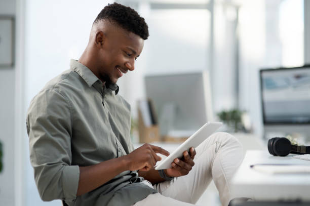 istock Shot of a young businessman working on a computer in an office 1315385417