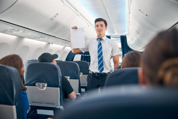 istock Handsome man holding safety information list to flight take off 1315388289
