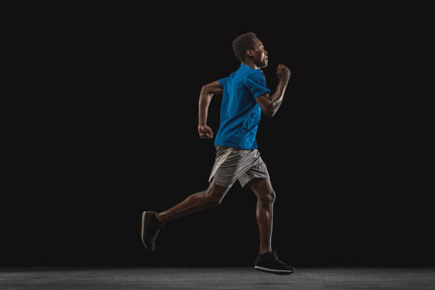 istock One young African-American man, athlete isolated over black background. 1315389033