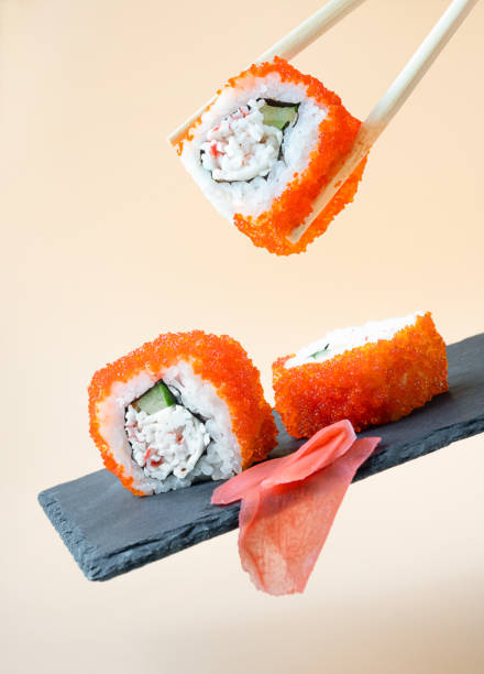 Traditional fresh japanese sushi rolls and ginger. levitation