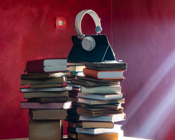 istock Photo Of Headset Microphone And Stack Of books 1315397372