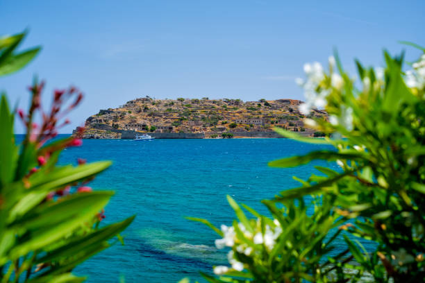 Island of Spinalonga with old fortress former leper colony and the bay of Elounda, Crete island, Greece