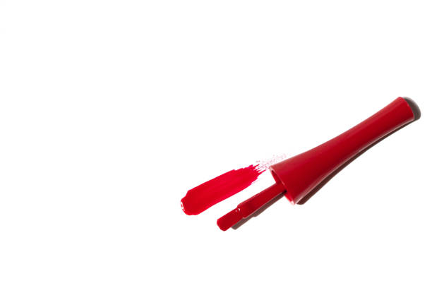 istock Red nail brush on white background. Red nail polish brushes isolated on white background 1315406341