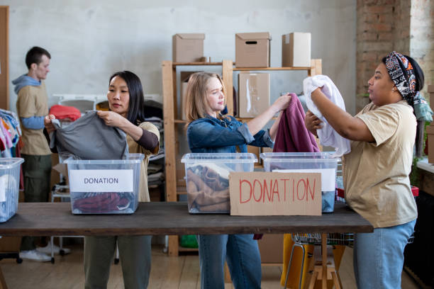 istock A group of people standing around a table with boxes on it 1315406440