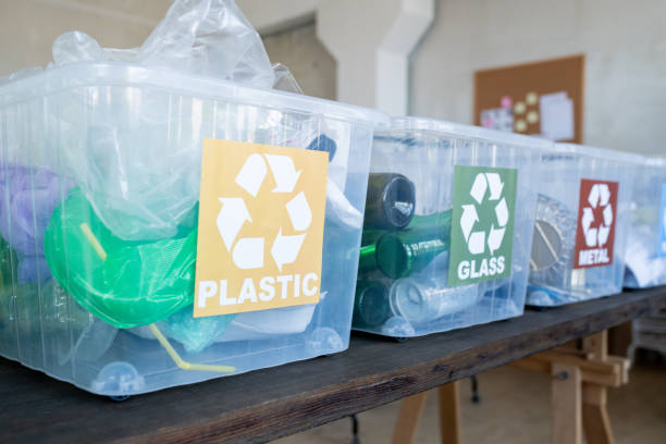 istock A group of plastic containers with donation clothes on a table 1315406548
