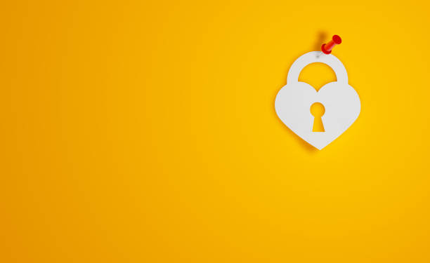 istock Pin Paper Heart Shape Padlock Symbol on Yellow Background 1315409489