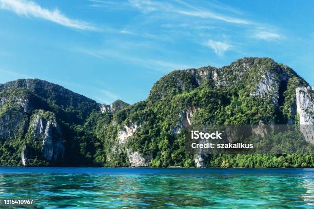 Sunny Bay In Thailand Lime Stone High Cliffs Beautiful Mountain Area View From Water Stock Photo - Download Image Now
