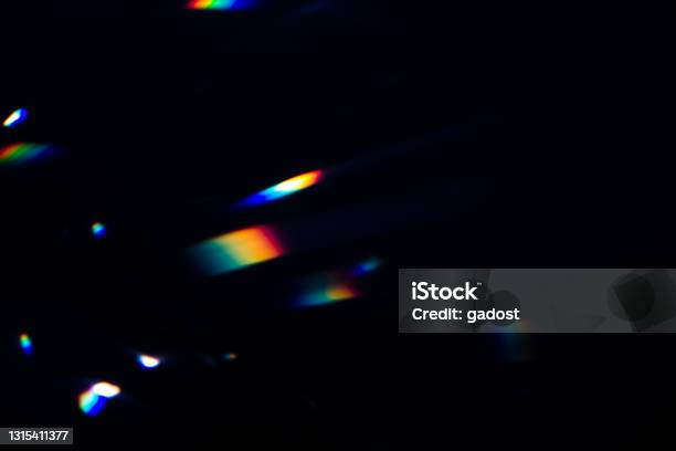 Colorful Warm Rainbow Crystal Light Leaks On Black Background Stock Photo - Download Image Now