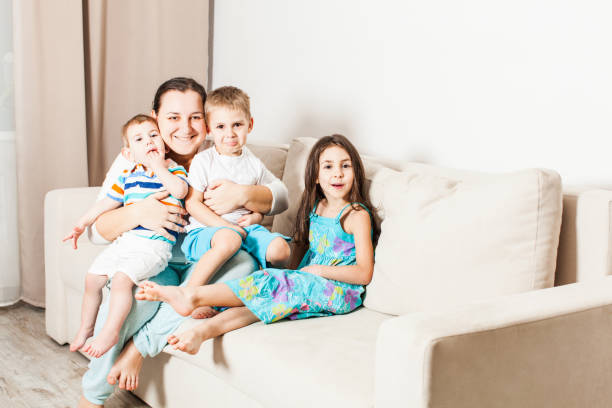 istock Full Length Of Friends Sitting On Sofa 1315411568
