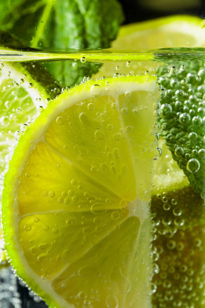 istock Carbonated drink with mint and lime slices. 1315412595