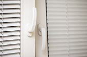 Open plastic window handle background. Home ventilation. Let fresh air inside.