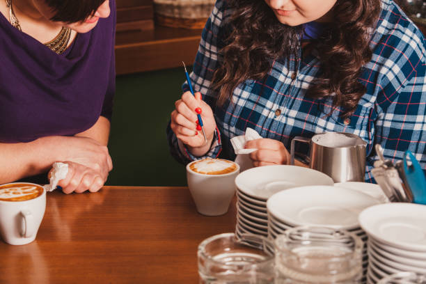 istock Midsection Of Woman Sitting At Table 1315413366