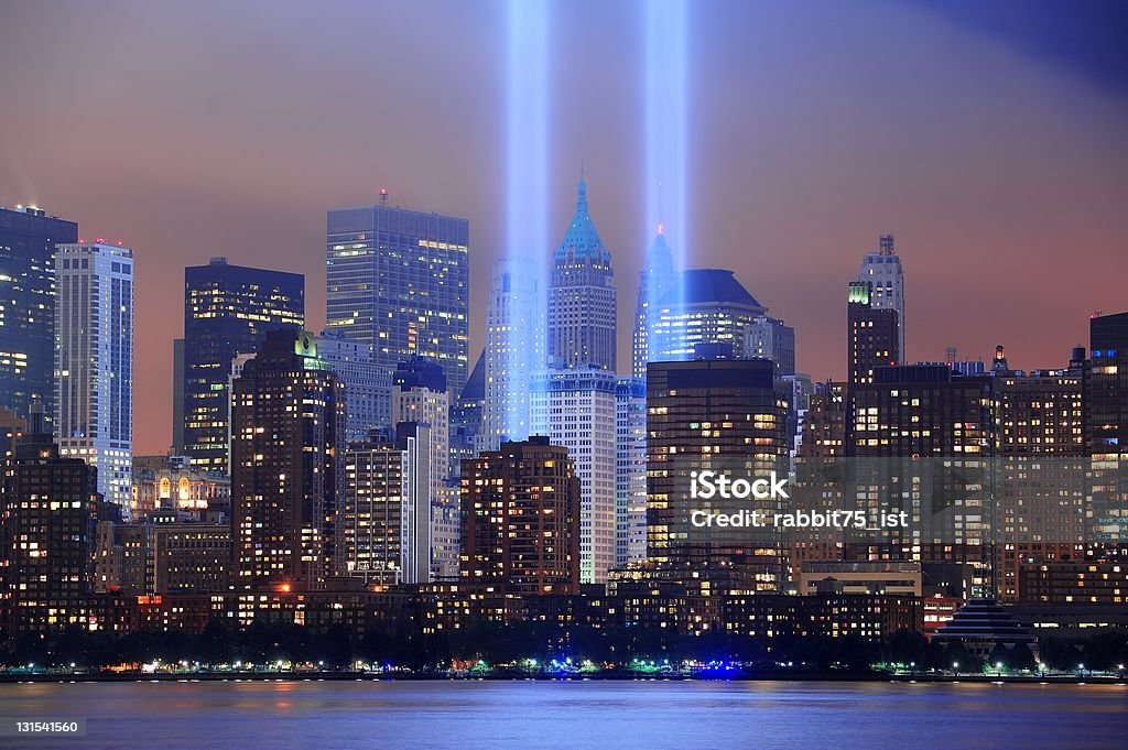 Light beams representing the Twin Towers in New York City  New York City Manhattan downtown skyline at night from Liberty Park with light beams in memory of September 11 viewed from New Jersey waterfront. September 11 2001 Attacks Stock Photo