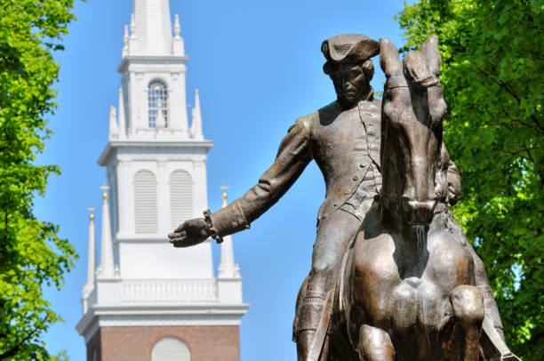 Paul Revere Statue and Old North Church Paul Revere statue in Boston Freedom Trail, a national landmark and major tourist attraction. Old North Church steeple in the back. north end boston photos stock pictures, royalty-free photos & images
