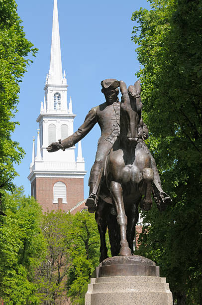 Paul Revere Statue Paul Revere statue in Boston Freedom Trail, a national landmark and major tourist attraction. Old North Church steeple in the back. north end boston photos stock pictures, royalty-free photos & images