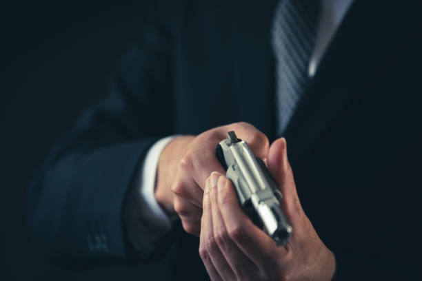 istock A man holding revolver pistol 1315418199
