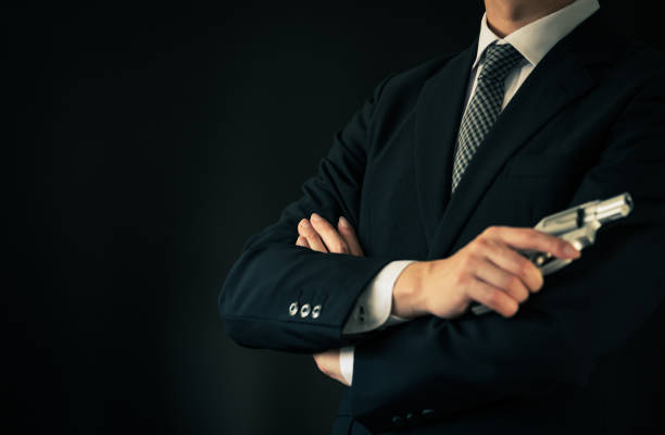 istock A man holding revolver pistol 1315418546