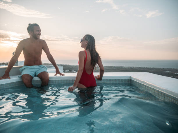 istock Romantic couple contemplate sunset from a hot tub 1315418952
